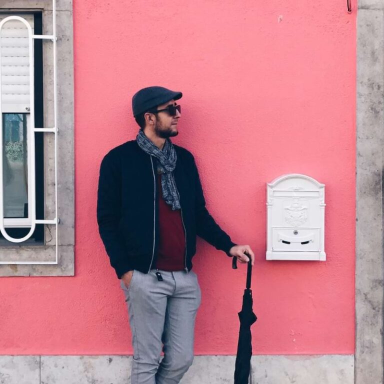 Dressed for a cool day in Cascais, Portugal with an umbrella