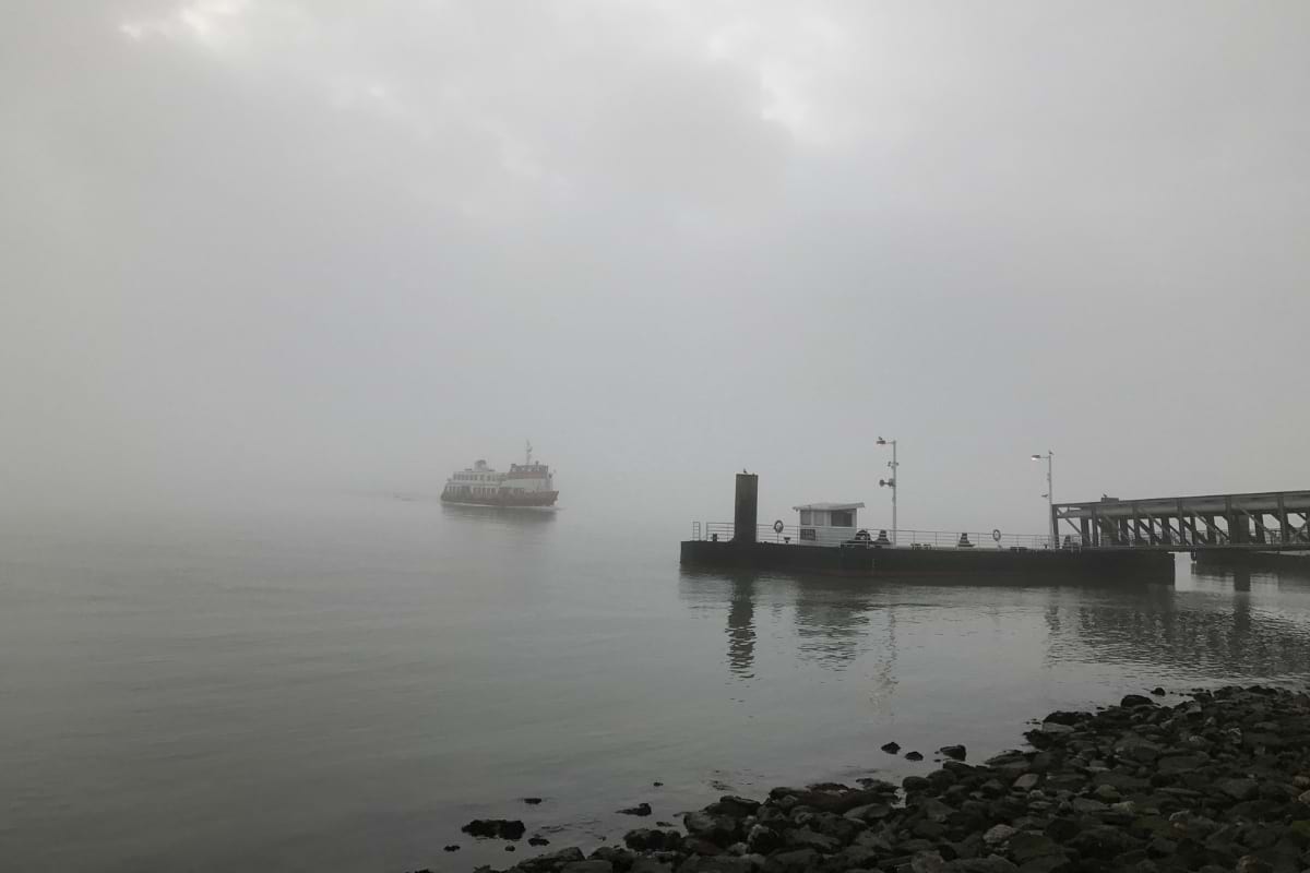 A ferry from Cacilhas to Cais do Sodre on a moody day
